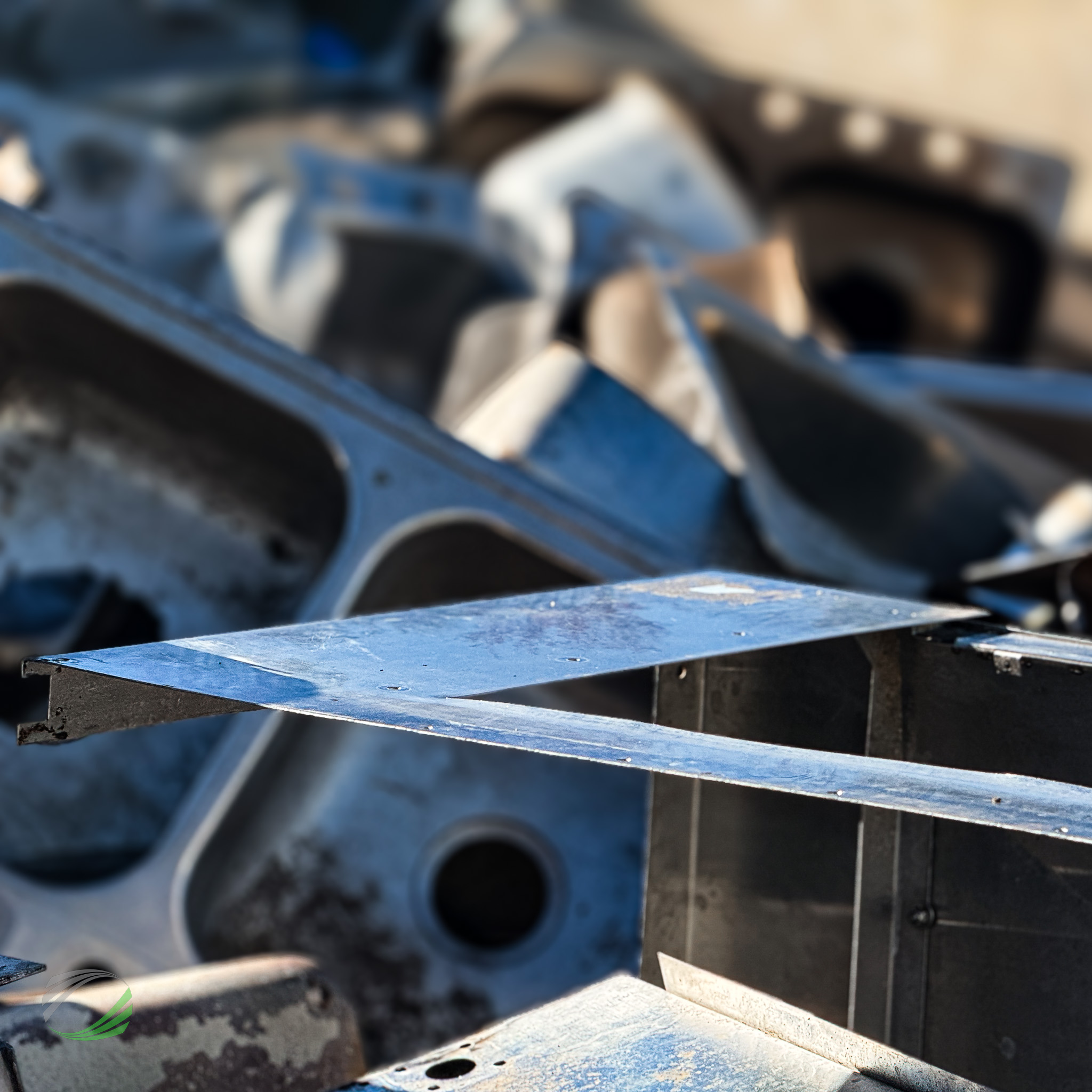Brass fixtures and valves collected in a bin